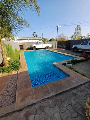 Vende se Moradia nova tipo 3 com piscina quarto suite climatizado água quente cozinha moderna, anexos canil no bairro da matola rio